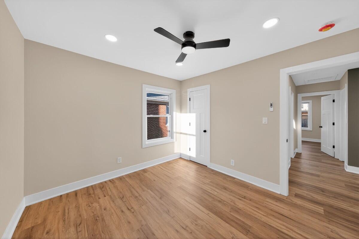 423 Cline Avenue Griffith, IN 46319 - Photo 17 of 33 a view of wooden floor and a ceiling fan in a room