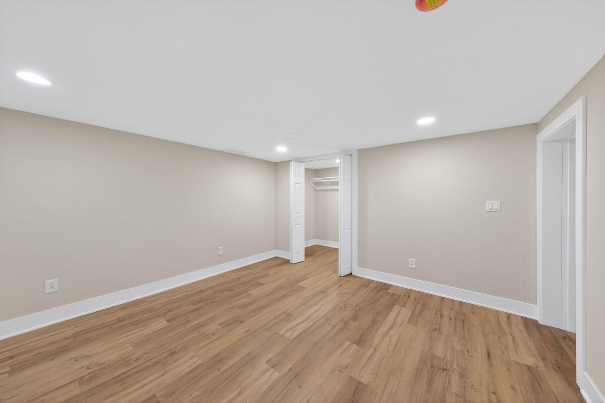 423 Cline Avenue Griffith, IN 46319 - Photo 20 of 33 a view of an empty room with wooden floor