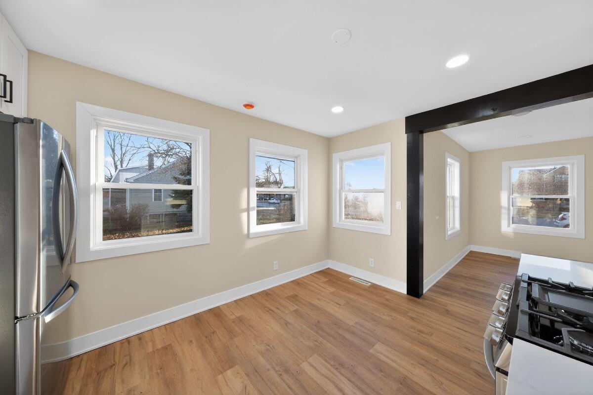 423 Cline Avenue Griffith, IN 46319 - Photo 8 of 33 a view of livingroom with furniture wooden floor and window