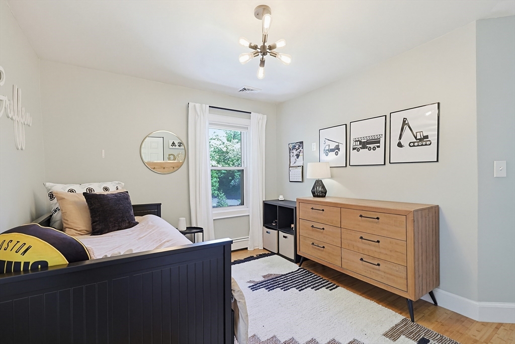 345 Sherman Street Canton, MA 02021 - Photo 29 of 42 a bedroom with a bed and window