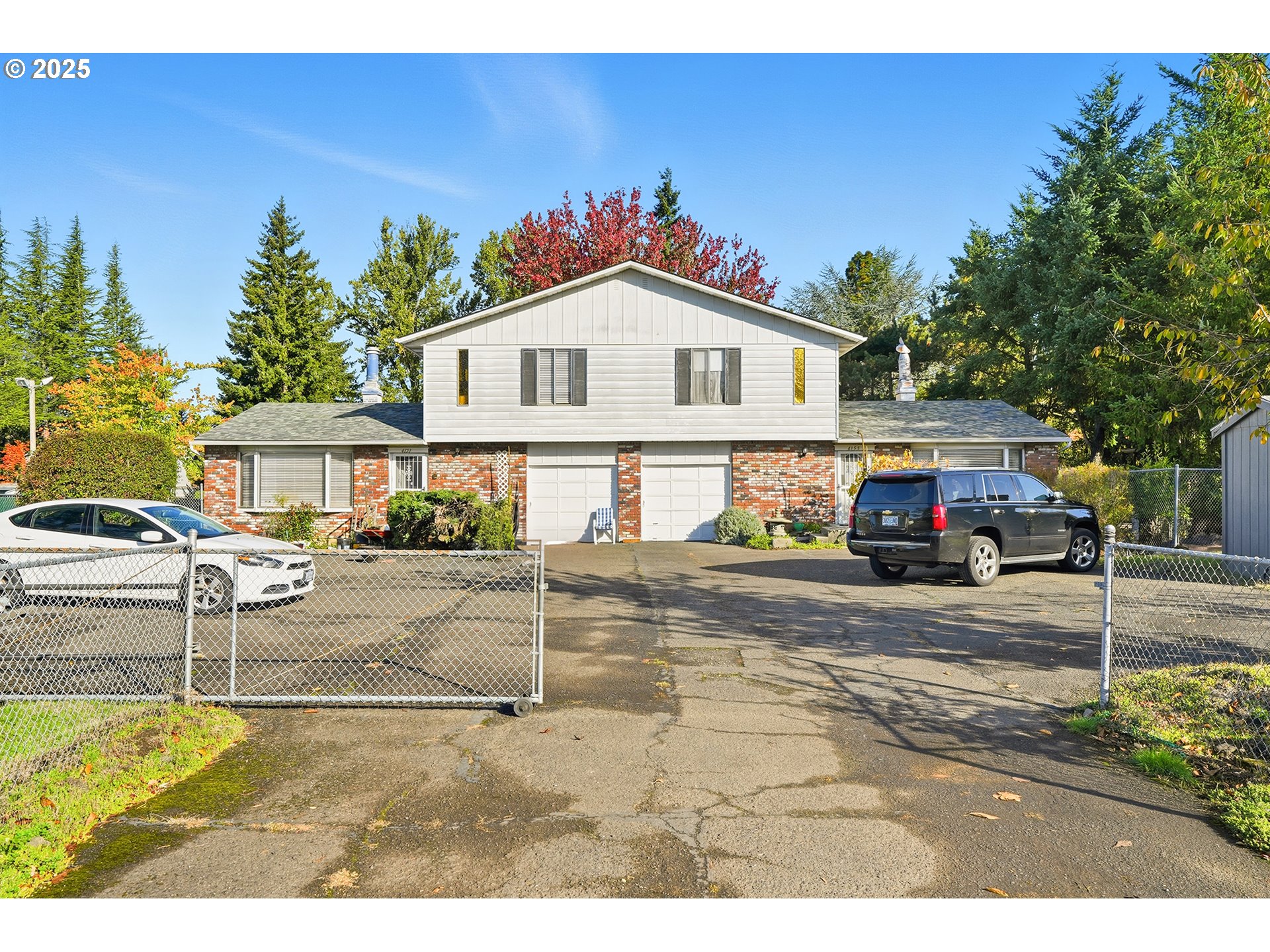 4151 Northeast 8th Street Gresham, OR 97030 - Photo 2 of 33 a front view of a house with a garden