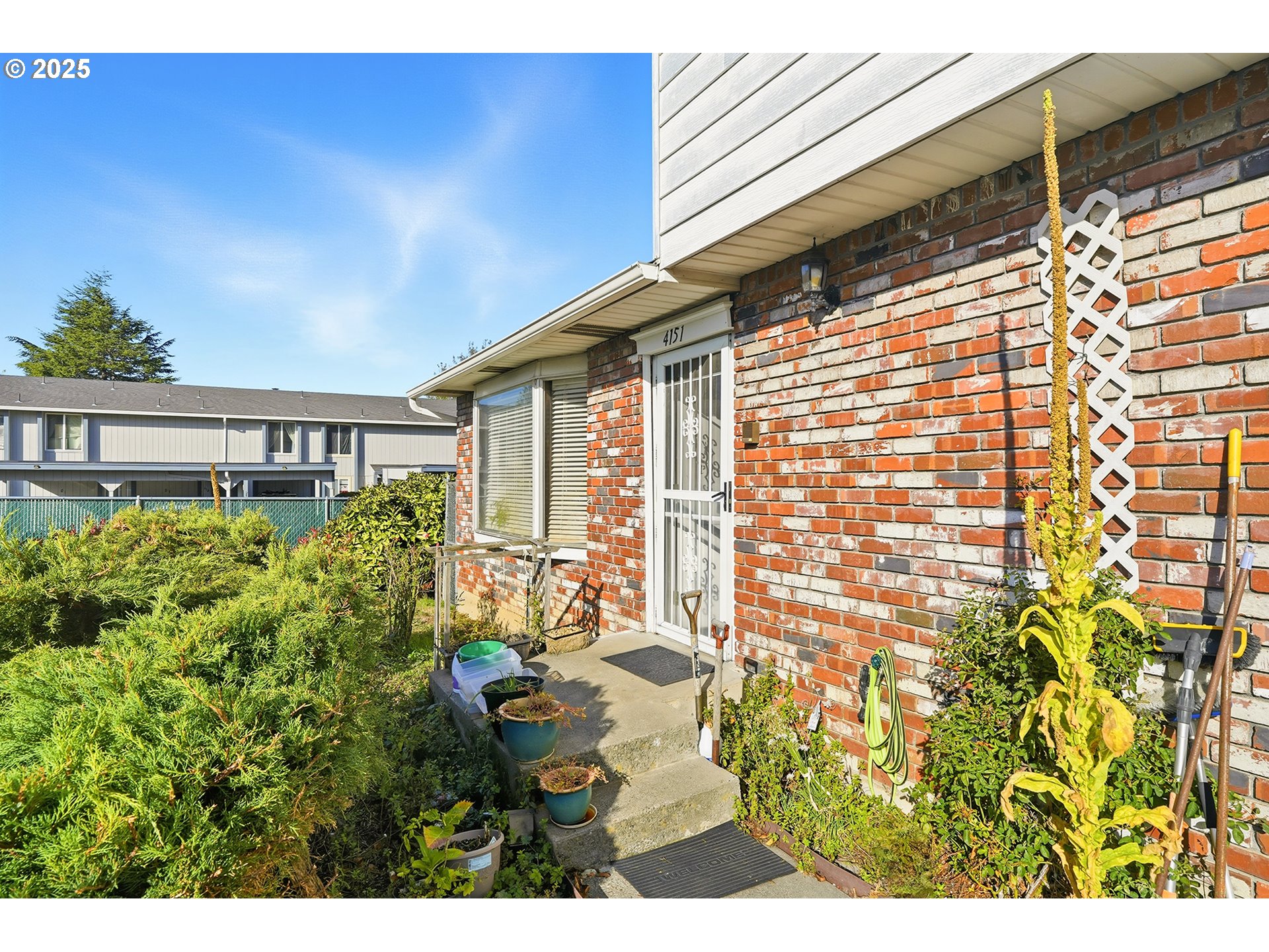 4151 Northeast 8th Street Gresham, OR 97030 - Photo 5 of 33 a view of a patio with table and chairs and potted plants