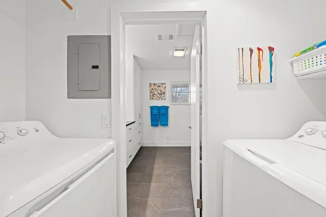 a bathroom with a double vanity sink and mirror