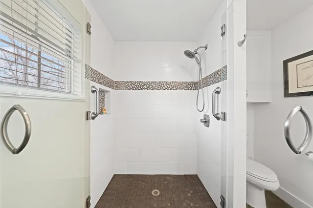 a bedroom with furniture and a wooden floor