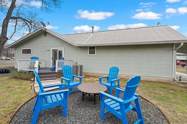 a view of a two chairs in the balcony