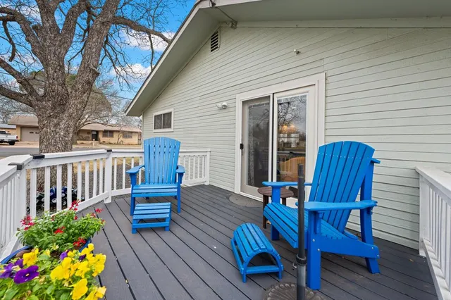 a view of a house with snow on the road