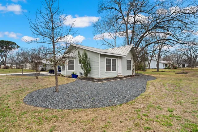 a house view with a garden space