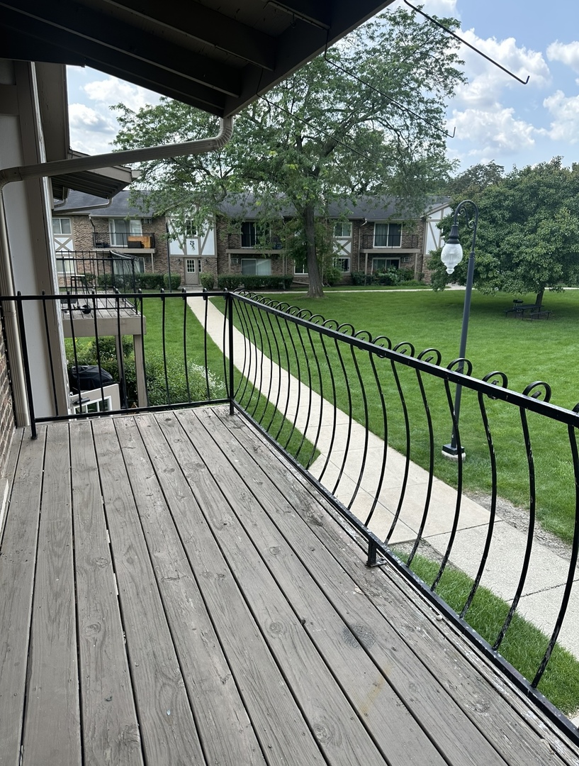 9s070 South Frontage Road, Unit 204 Willowbrook, IL 60527 - Photo 14 of 18 a view of balcony with wooden floor