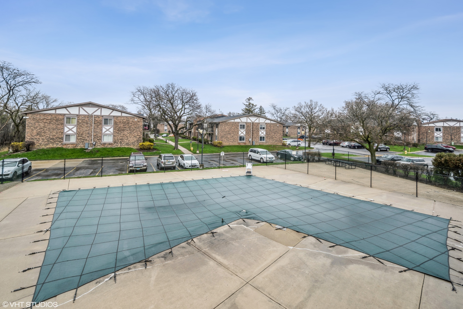 9s070 South Frontage Road, Unit 204 Willowbrook, IL 60527 - Photo 17 of 18 a view of a swimming pool with a yard