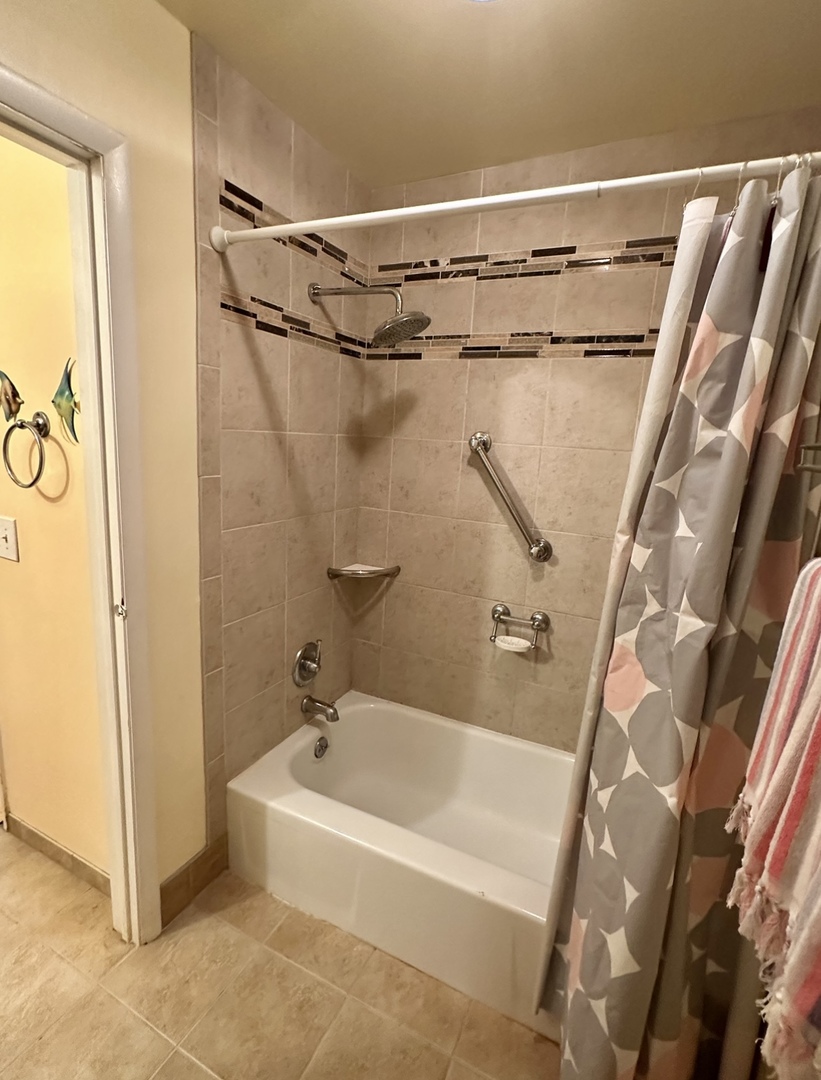 9s070 South Frontage Road, Unit 204 Willowbrook, IL 60527 - Photo 6 of 18 a white bath tub sitting next to a shower
