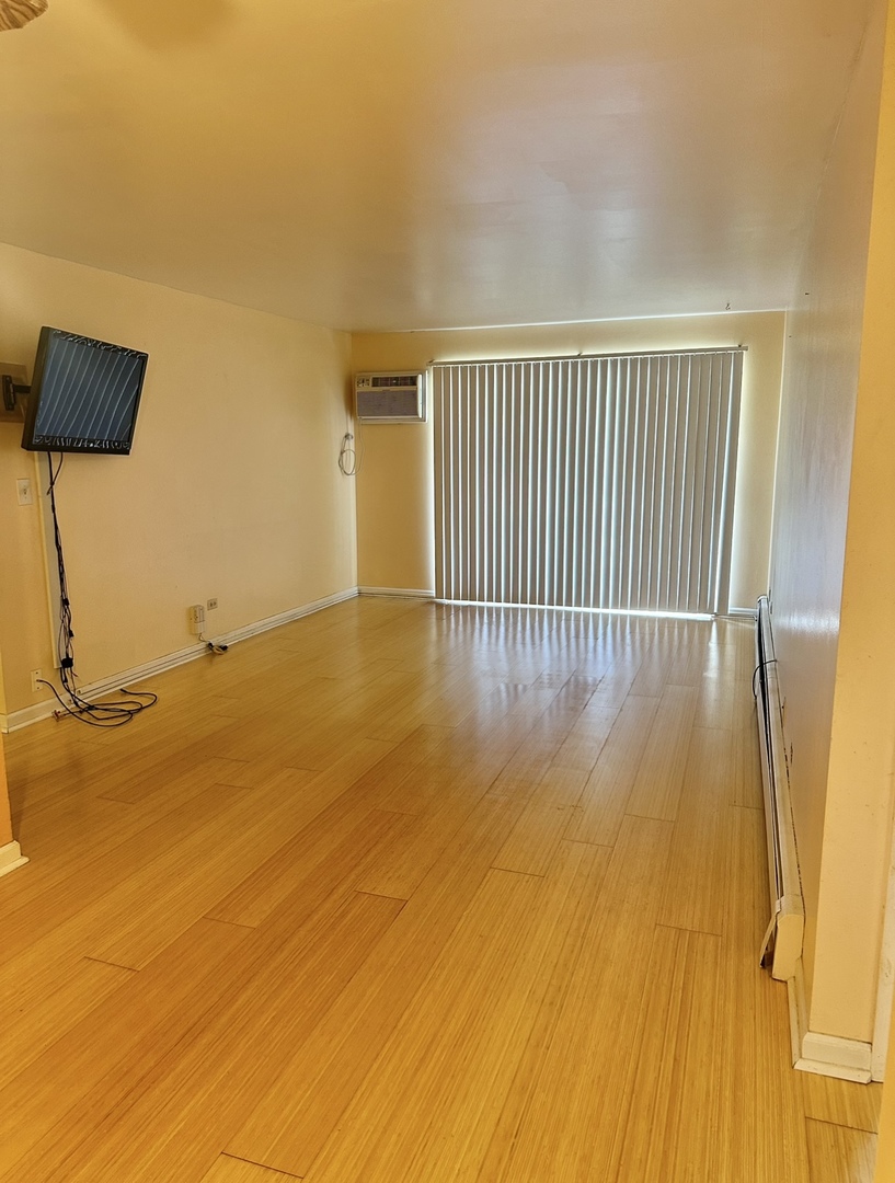 9s070 South Frontage Road, Unit 204 Willowbrook, IL 60527 - Photo 9 of 18 a view of a room with wooden floor