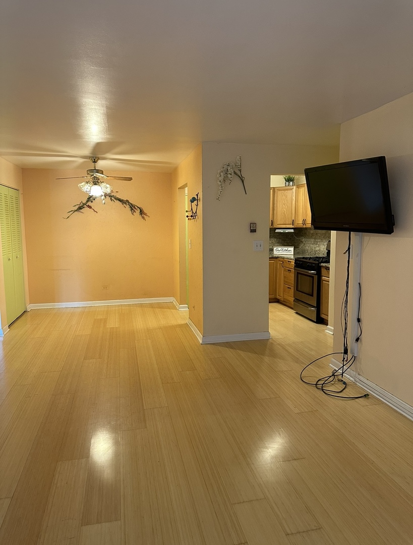 9s070 South Frontage Road, Unit 204 Willowbrook, IL 60527 - Photo 10 of 18 a view of a livingroom with a flat screen tv