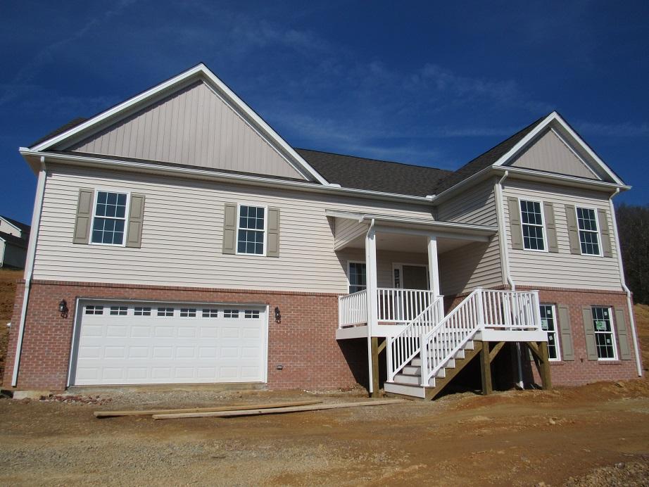4441 Old Stage Road Radford, VA 24141 - Photo 1 of 32 a front view of a house with a yard