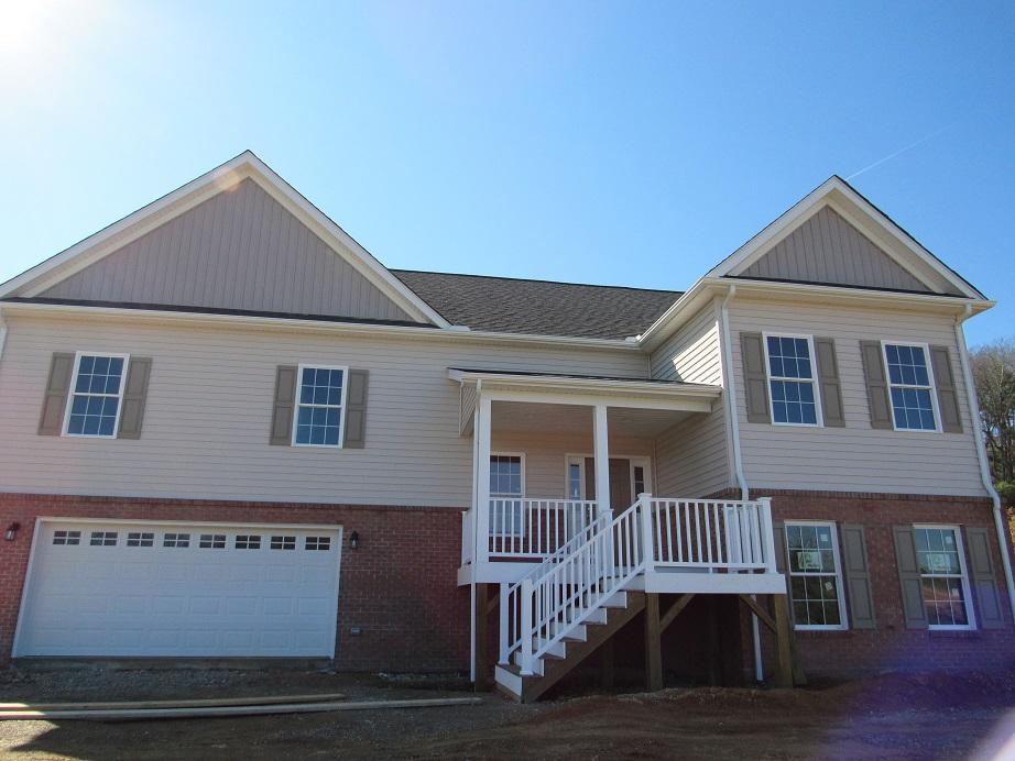 4441 Old Stage Road Radford, VA 24141 - Photo 2 of 32 a front view of a house with a porch