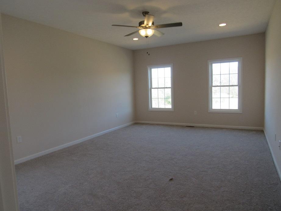 4441 Old Stage Road Radford, VA 24141 - Photo 12 of 32 an empty room with a window and a fan
