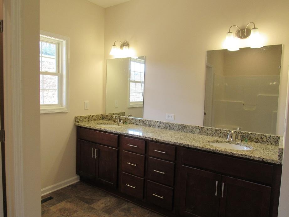 4441 Old Stage Road Radford, VA 24141 - Photo 15 of 32 a bathroom with a granite countertop double vanity sink and mirror