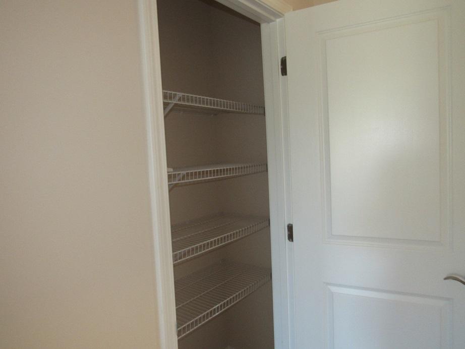 4441 Old Stage Road Radford, VA 24141 - Photo 17 of 32 a walk in closet with wooden floor