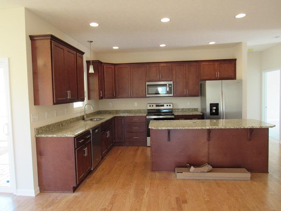 4441 Old Stage Road Radford, VA 24141 - Photo 6 of 32 a large kitchen with stainless steel appliances granite countertop a stove a sink and a refrigerator