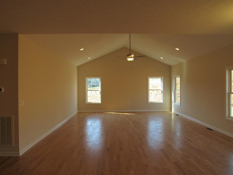 4441 Old Stage Road Radford, VA 24141 - Photo 7 of 32 an empty room with wooden floor and windows