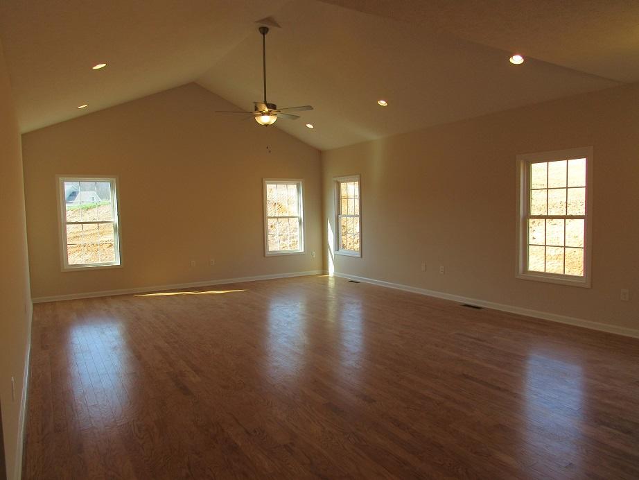 4441 Old Stage Road Radford, VA 24141 - Photo 8 of 32 an empty room with wooden floor and windows