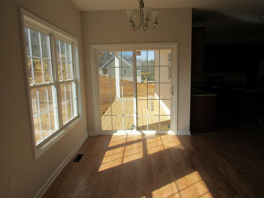 4441 Old Stage Road Radford, VA 24141 - Photo 10 of 32 a view of an empty room with wooden floor and a window