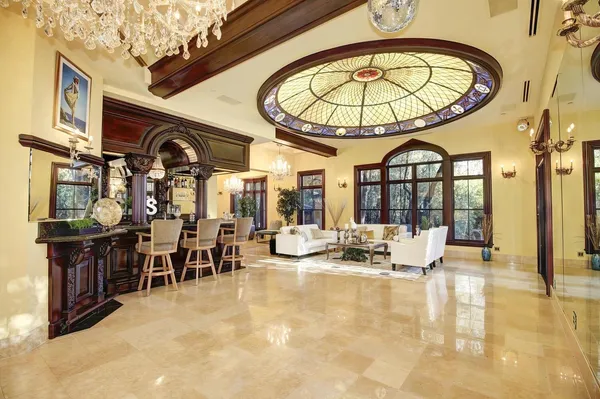 a living room with furniture and a large window
