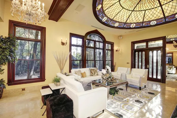 a view of balcony with wooden floor and fence