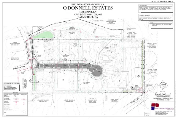 an aerial view of a house with a yard and large trees