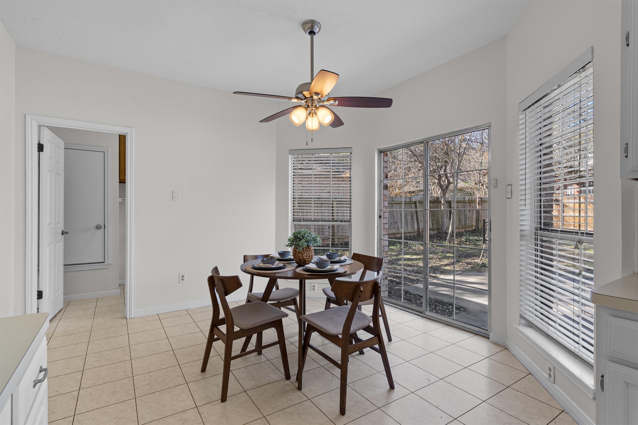 10506 Walpole Lane Austin, TX 78739 - Photo 19 of 40 Dining space featuring a ceiling fan and light tile patterned floors