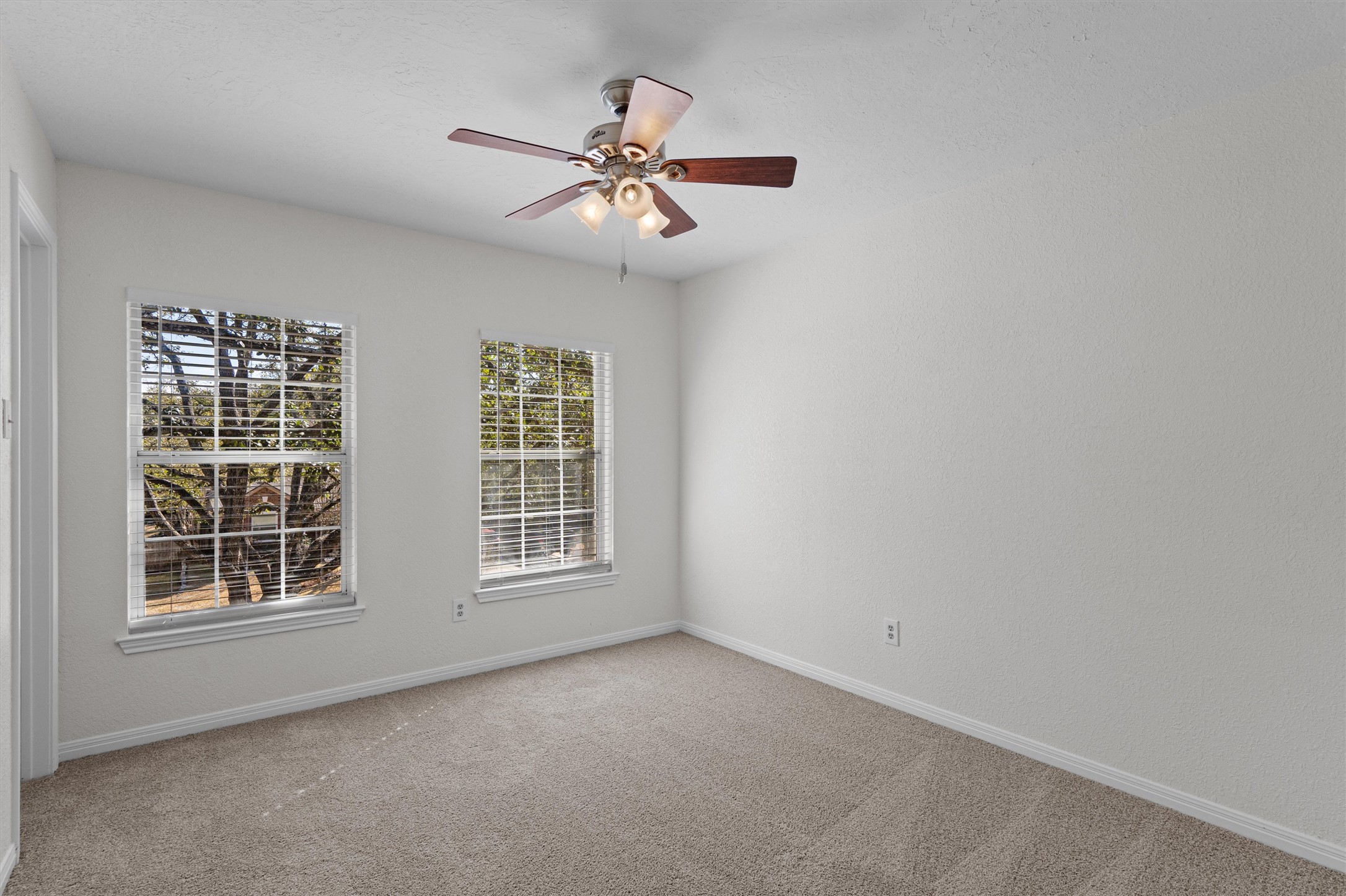 10506 Walpole Lane Austin, TX 78739 - Photo 30 of 40 Empty room featuring light carpet and a ceiling fan