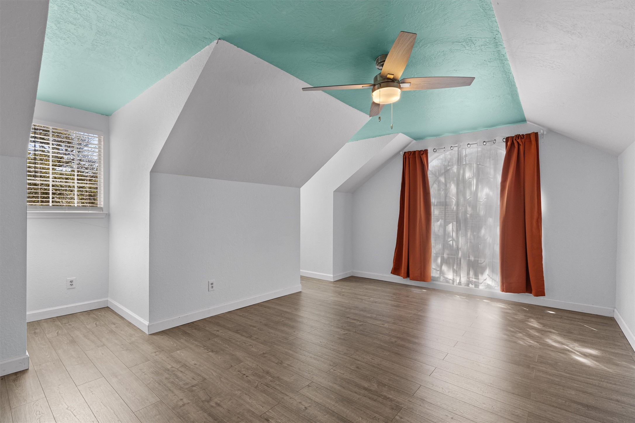 10506 Walpole Lane Austin, TX 78739 - Photo 34 of 40 Bonus room with healthy amount of natural light, a ceiling fan, and light wood finished floors