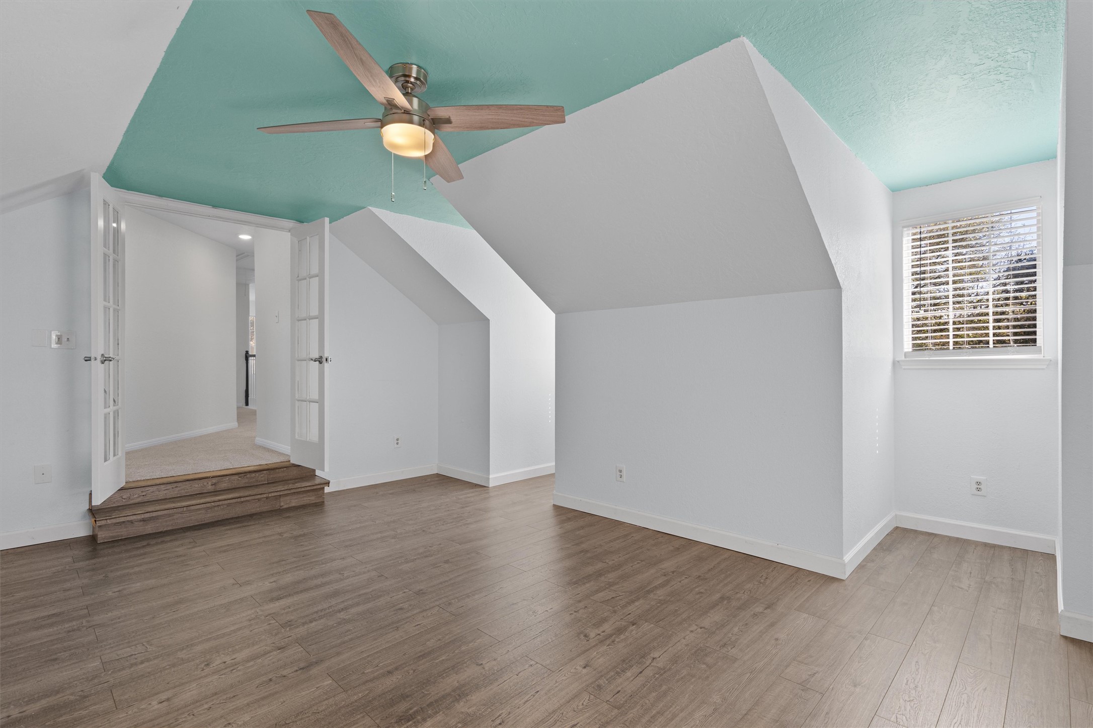 10506 Walpole Lane Austin, TX 78739 - Photo 35 of 40 Bonus room with vaulted ceiling, ceiling fan, and light wood-type flooring