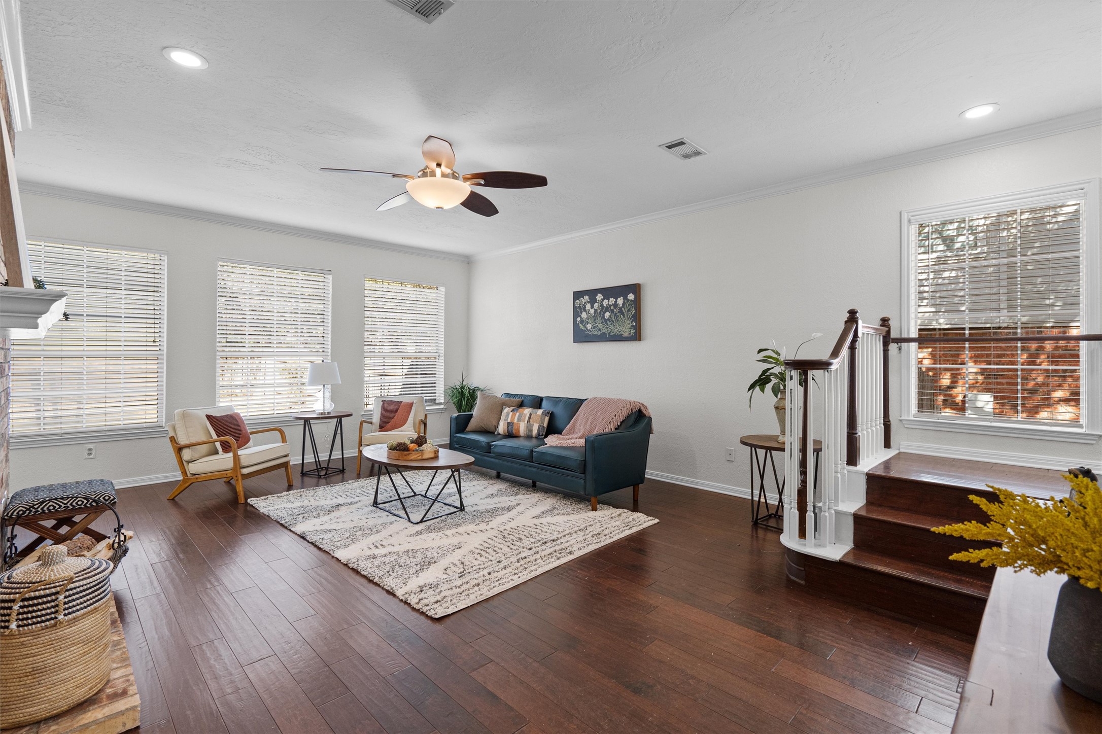 10506 Walpole Lane Austin, TX 78739 - Photo 8 of 40 Living area with dark wood-style floors, ceiling fan, ornamental molding, and recessed lighting
