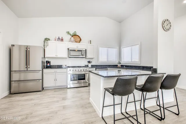a view of yard covered with snow in front of house