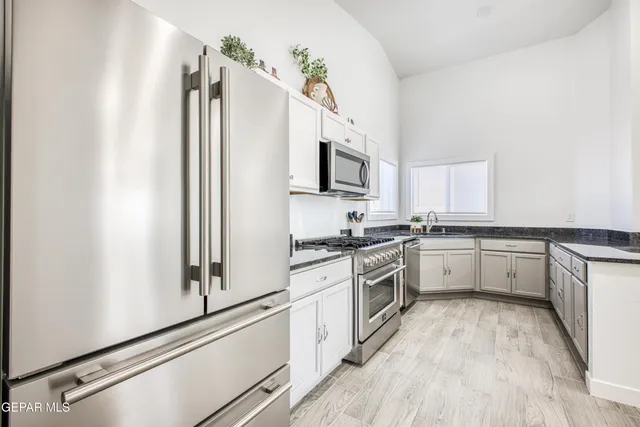 a view of yard covered with snow in front of house