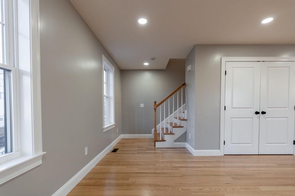214 Horton Street Fall River, MA 02723 - Photo 19 of 40 a view of entryway and hall with wooden floor
