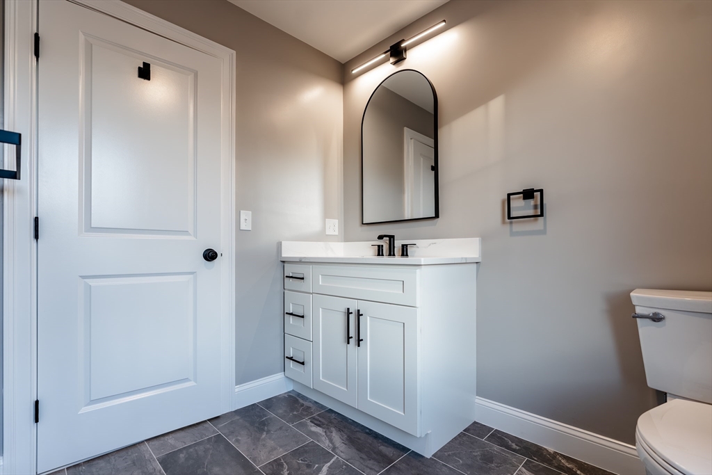 214 Horton Street Fall River, MA 02723 - Photo 21 of 40 a bathroom with a sink and a mirror