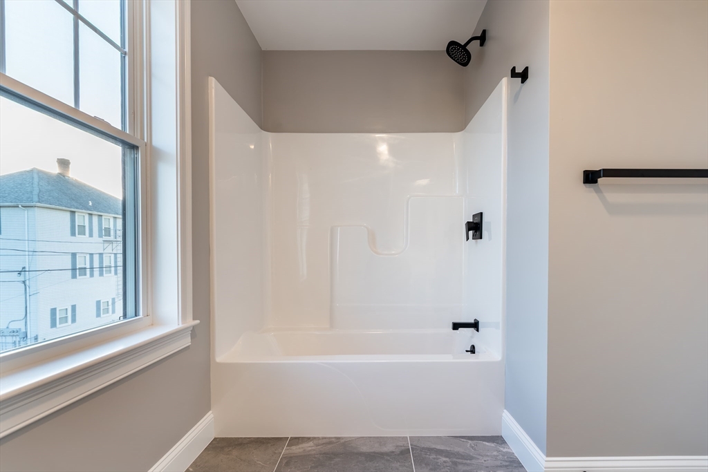 214 Horton Street Fall River, MA 02723 - Photo 22 of 40 a bathroom with a bathtub and a shower