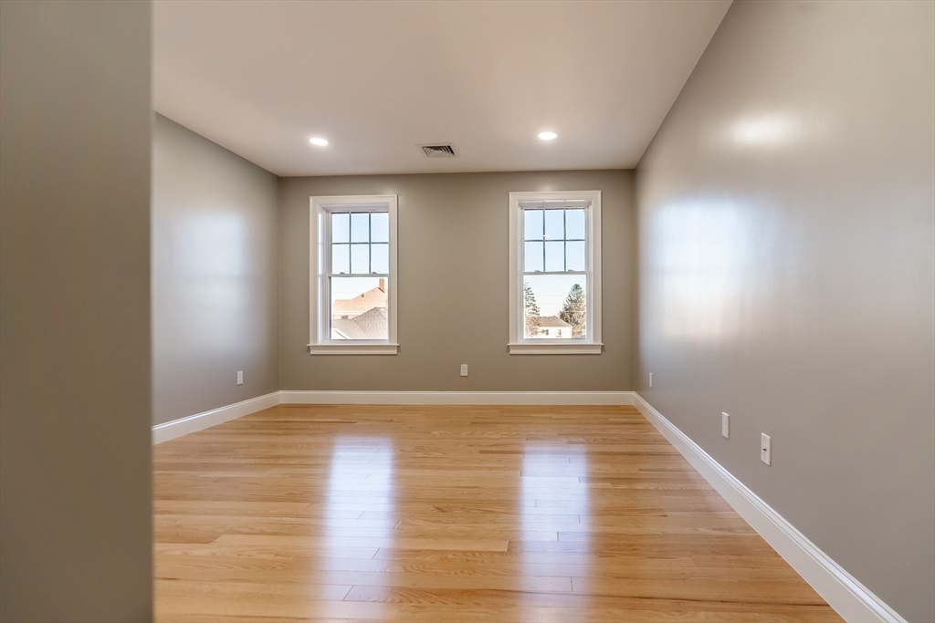 214 Horton Street Fall River, MA 02723 - Photo 25 of 40 a view of an empty room with wooden floor and window
