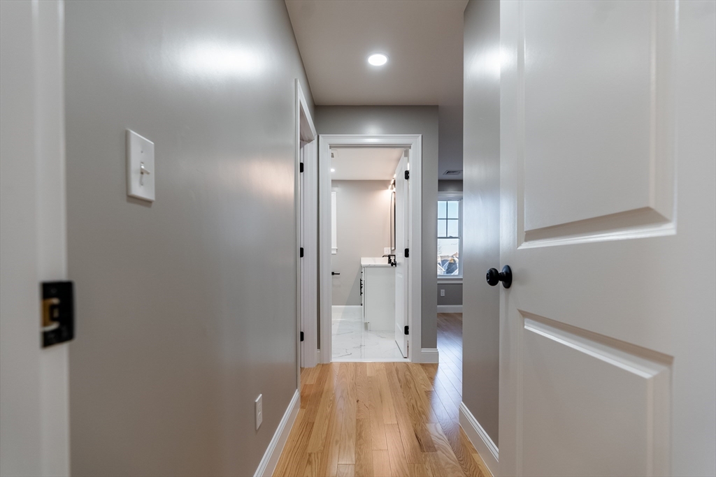 214 Horton Street Fall River, MA 02723 - Photo 27 of 40 a bathroom with a sink and a glass door shower