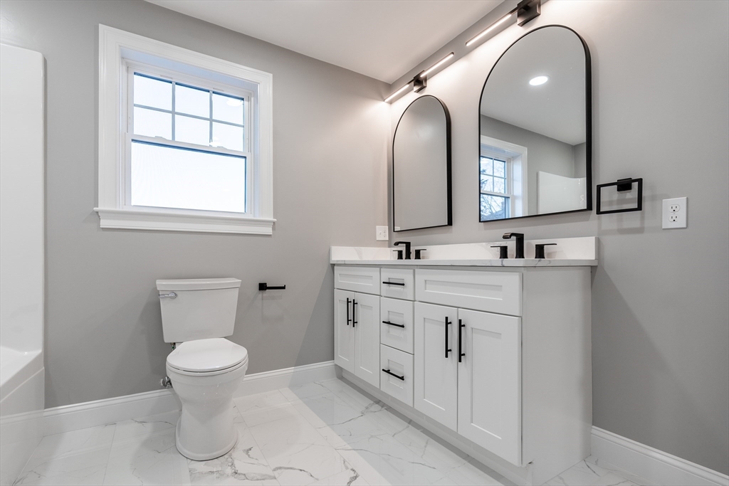 214 Horton Street Fall River, MA 02723 - Photo 30 of 40 a bathroom with a double vanity sink and a toilet