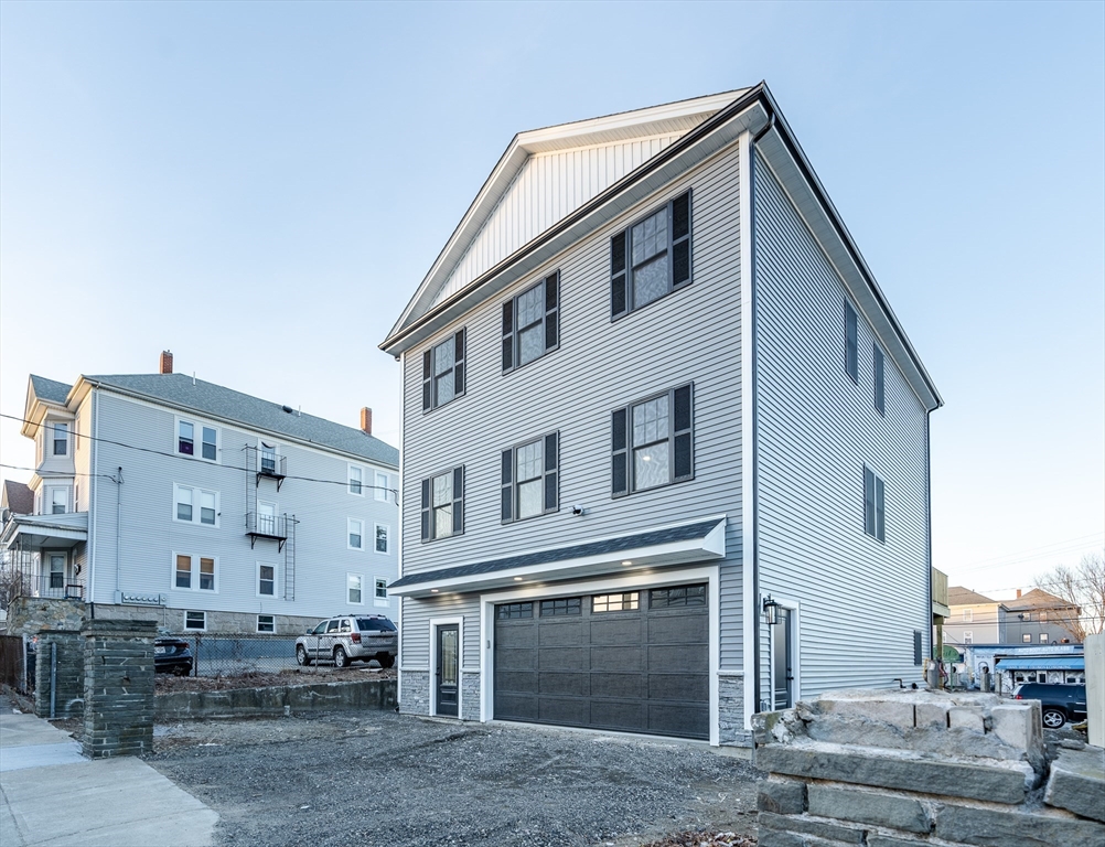 214 Horton Street Fall River, MA 02723 - Photo 3 of 40 a front view of a house with a yard