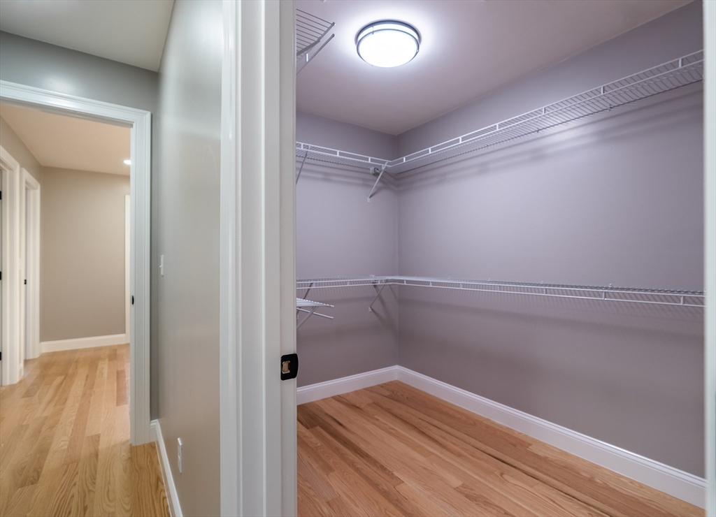 214 Horton Street Fall River, MA 02723 - Photo 31 of 40 a view of walk in closet with wooden floor