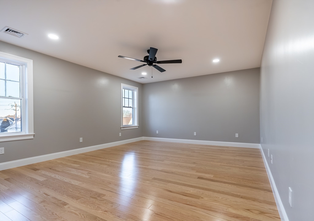 214 Horton Street Fall River, MA 02723 - Photo 32 of 40 wooden floor in an empty room with a window
