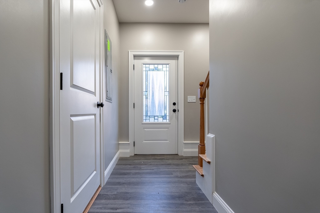 214 Horton Street Fall River, MA 02723 - Photo 37 of 40 a view of a hallway with wooden floor and closet