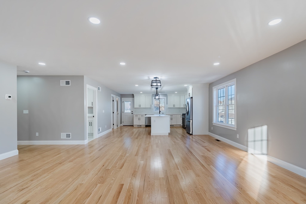 214 Horton Street Fall River, MA 02723 - Photo 6 of 40 a view of a living room a window and wooden floor
