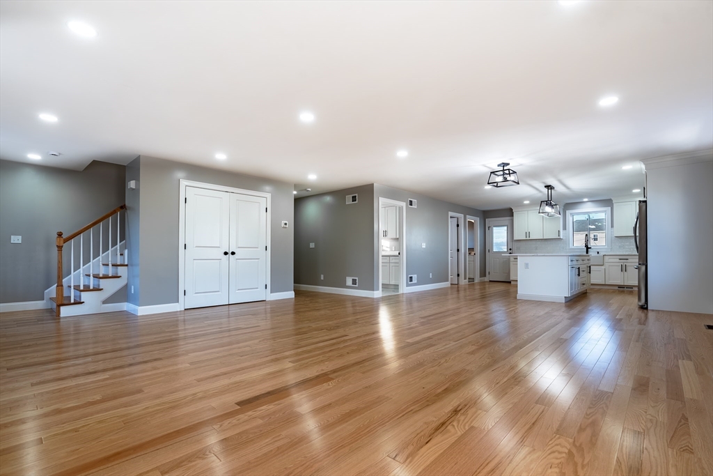 214 Horton Street Fall River, MA 02723 - Photo 7 of 40 a view of a living room and kitchen with wooden floor