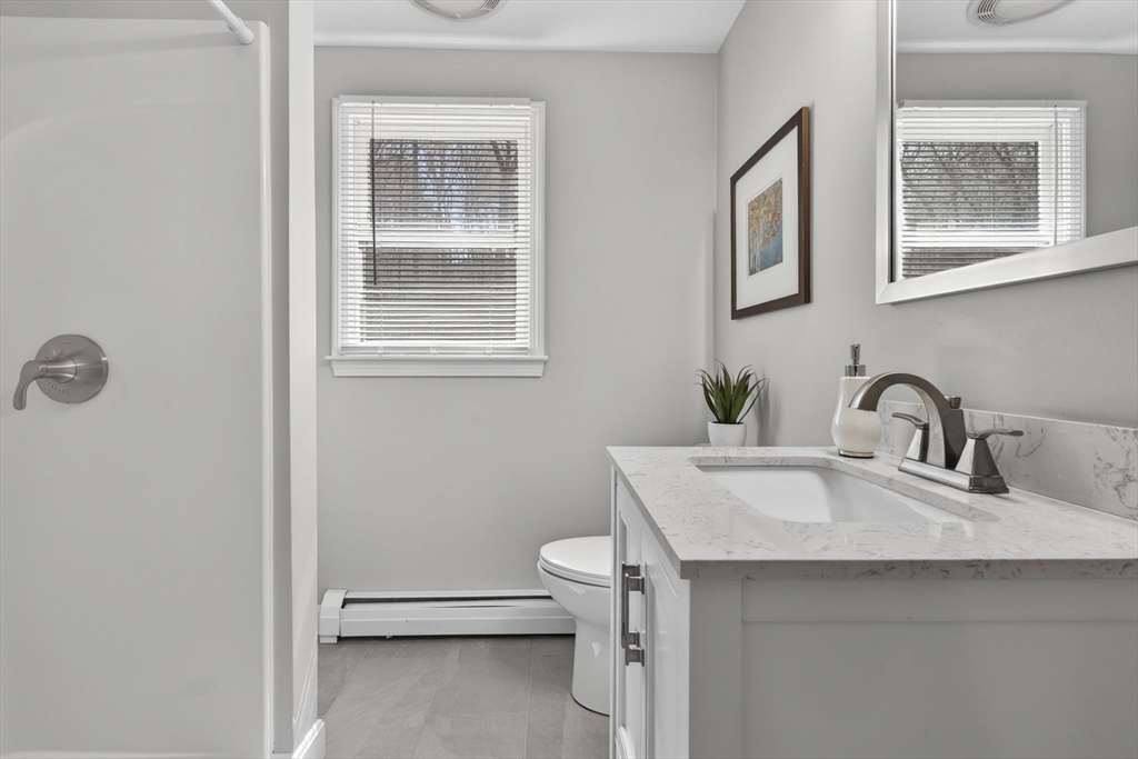 111 Goss Lane Lancaster, MA 01523 - Photo 13 of 39 a bathroom with a sink toilet and mirror