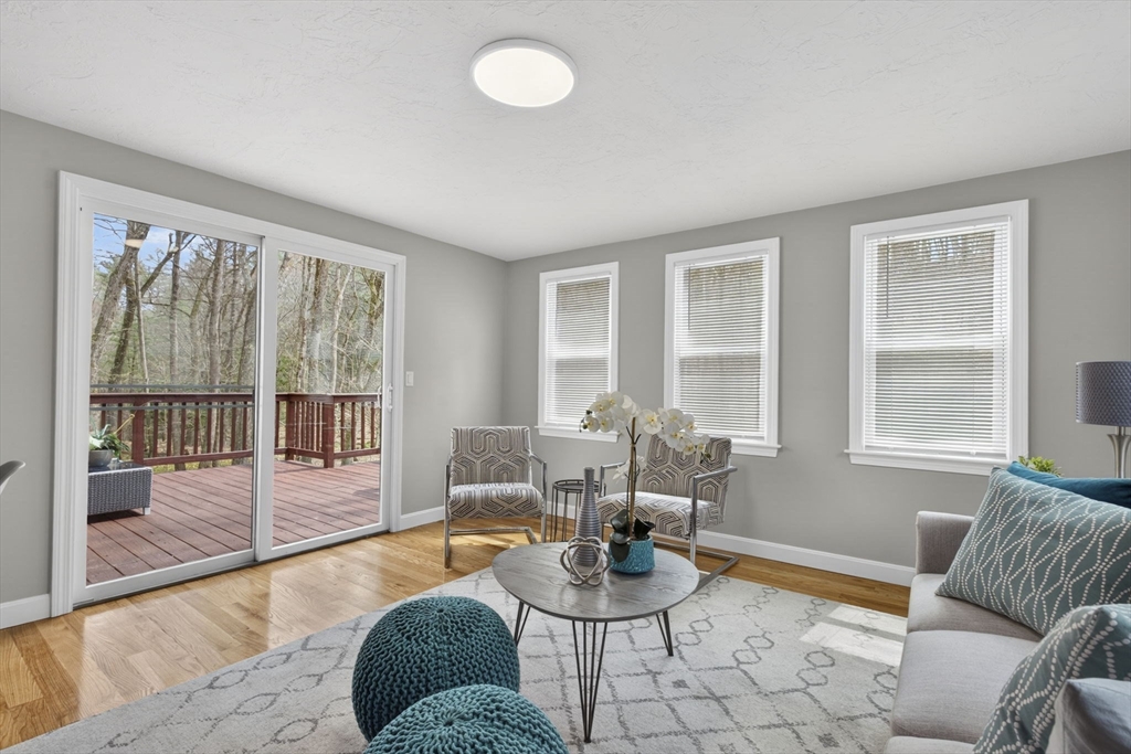 111 Goss Lane Lancaster, MA 01523 - Photo 16 of 39 a living room with furniture and a window