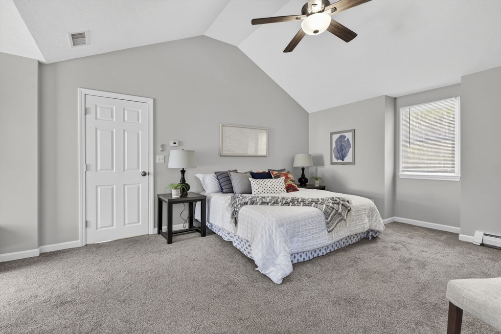 111 Goss Lane Lancaster, MA 01523 - Photo 20 of 39 a spacious bedroom with a bed a window and closet